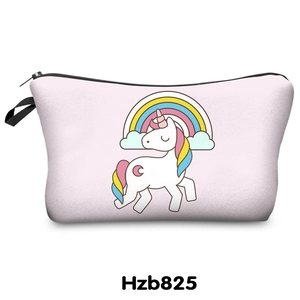 Close-up of pink cosmetic bag with unicorn rainbow print and black zipper detail