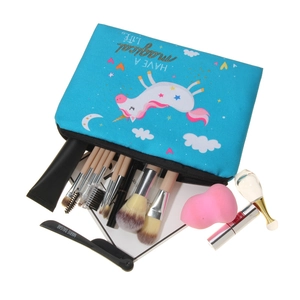 Blue 3D unicorn makeup bag with star patterns and professional cosmetic storage scene