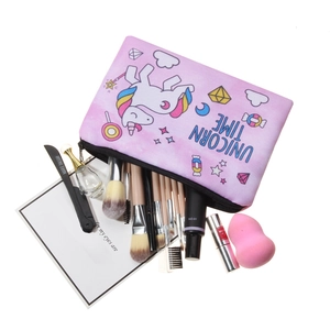 Trousse à maquillage licorne rose avec fermeture éclair contenant pinceaux et produits