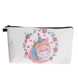 Detail of cartoon unicorn print and floral patterns on white fabric cosmetic bag