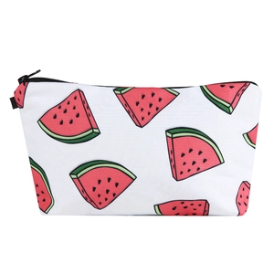 Detail of summer watermelon print makeup bag showing fabric texture and black zipper
