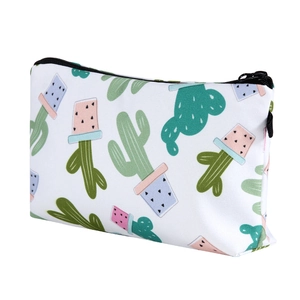 Detail view of stylish cactus print cosmetic bag showing black zipper and canvas texture