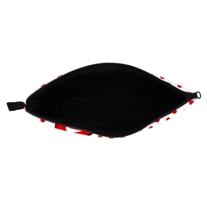 Polka dot makeup bag with red spots and black lining shown from a top-down open view
