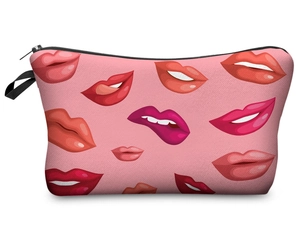Detail view of pink makeup bag with red lip prints and secure top zipper closure
