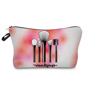 Detail view of the fabric makeup bag featuring printed brushes and makeup text lettering