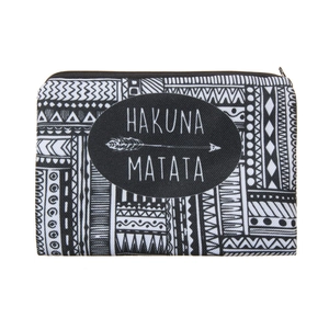 Detailed view of the Hakuna Matata canvas makeup bag with black and white 3D geometric patterns
