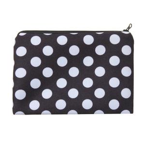 Detailed view of the smooth black metal zipper on the classic polka dot cosmetic bag