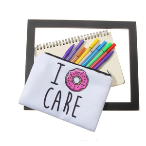 3D donut print canvas cosmetic bag for women shown with colorful stationery on white background