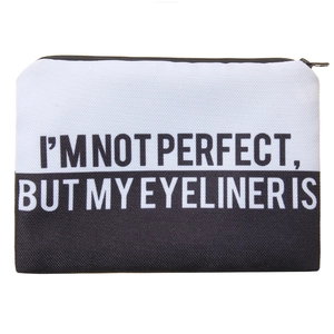 Detail of square Oxford makeup bag with bold black and white design and eyeliner slogan