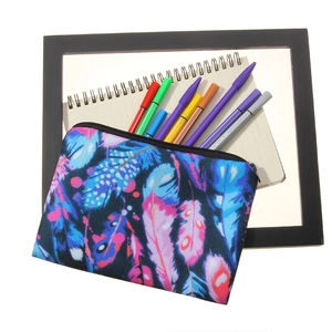 Multipurpose makeup pouch with vibrant 3D feather print and durable black zipper closure