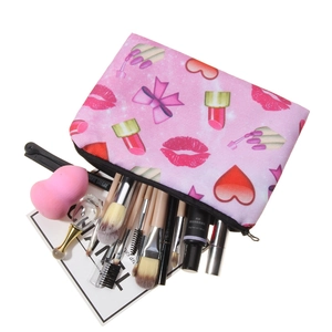 Pink lipstick makeup storage bag with 3D prints of red lips, hearts and cosmetic brushes