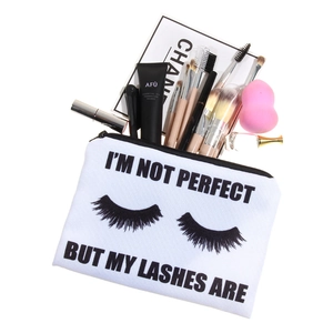 White canvas makeup bag with eyelash print and large storage capacity for beauty tools