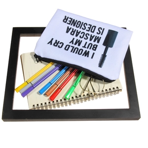 White canvas pouch with mascara quote, holding pens and glasses on a white background