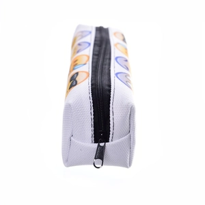 Canvas makeup bag with emoji digital print and black zipper on white background