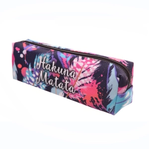 Macro view of Oxford fabric pencil case with colorful feather print and Hakuna Matata text