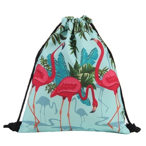 Detail of flamingo print drawstring bag with tropical palm leaves and black cotton ropes