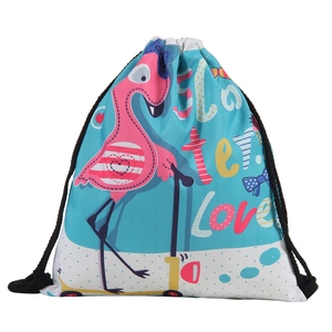 Detail of cartoon flamingo print on blue polka dot drawstring bag with black cords