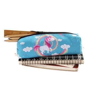 Detailed close-up of blue Oxford makeup bag with rainbow unicorn print on stationery