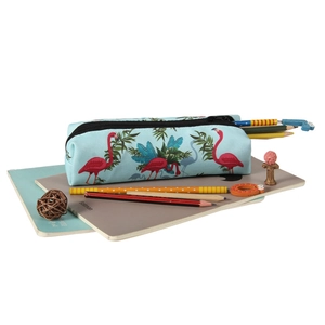 Detailed close-up of flamingo and palm leaf print on oxford fabric cosmetic pouch