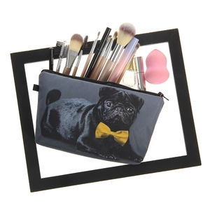 Detailed view of the cute pug print cosmetic bag showing interior storage and brushes