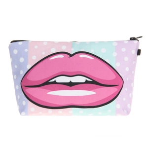 Detail view of stylish makeup bag featuring bold pink lips and colorful polka dot pattern