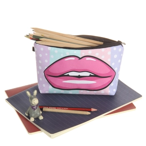 Detail view of the canvas makeup bag with pink lip print showing its storage capacity