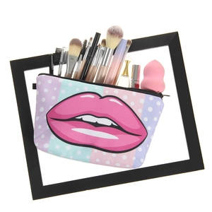 Chic pink lip print makeup bag with colorful polka dot pattern and zipper closure
