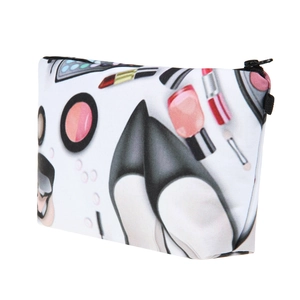 Detail of white makeup bag featuring stylish shoe and lipstick prints with black zipper