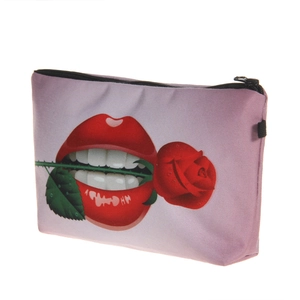 Close-up of lilac makeup bag with red lips and rose print with black zipper detail