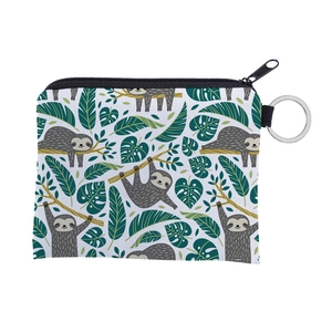 Detail shot of mini coin purse with cartoon sloth print and silver metal keychain ring