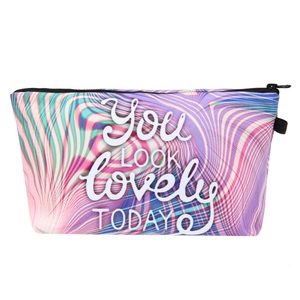 Detail of artistic white text You LOOK lovely TODAY on a colorful swirl pattern bag