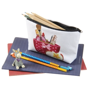 Detail showing the inner capacity of a printed canvas makeup bag filled with pencils
