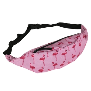 Close-up of pink canvas waist bag featuring red flamingo prints and black nylon strap