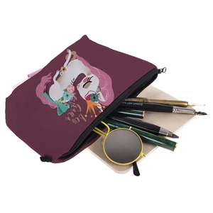 Close-up of unicorn print canvas makeup pouch with zipper and floral Be the Queen text