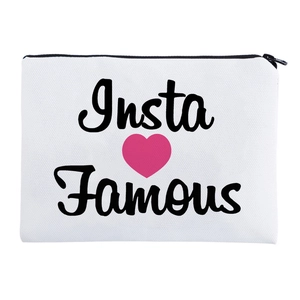 Detail of the black Insta Famous print with pink heart on white canvas makeup pouch