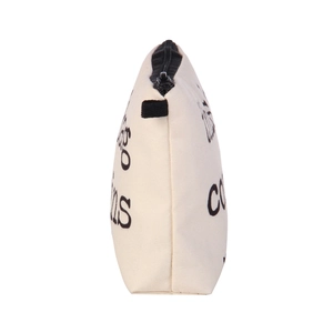 Canvas makeup bag with letter prints and a sturdy black zipper on an off-white base