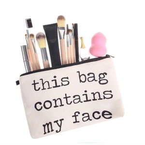 Canvas makeup bag with 'this bag contains my face' print and cosmetic accessories