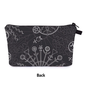 Back view of a black travel cosmetic bag featuring white mystic astrology symbols