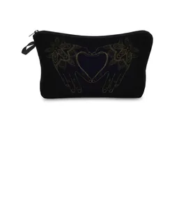 Detailed view of black travel pouch featuring golden mandala heart hand print design