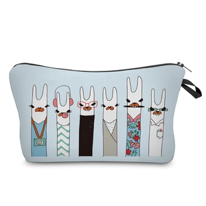 Detail of blue digital print makeup bag showing cartoon alpaca patterns and fabric texture