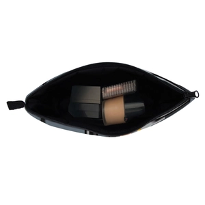 Top view of a geometric print makeup bag showing internal storage for cosmetics