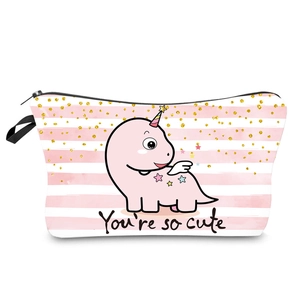 Detail of pink striped waterproof makeup bag with a cute cartoon dinosaur and small handle