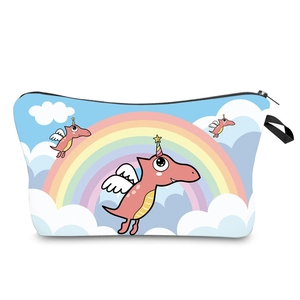 Detail view of pink unicorn dinosaur pattern on a light blue waterproof travel bag
