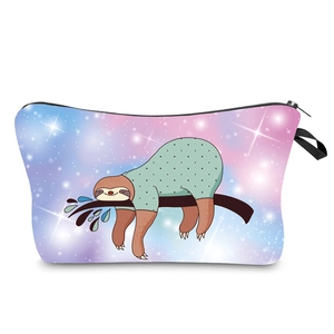 Detail of multi-functional travel pouch with digital nebula print and cartoon sloth pattern