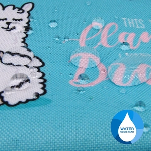 Macro view of water droplets beading on water resistant alpaca printed fabric
