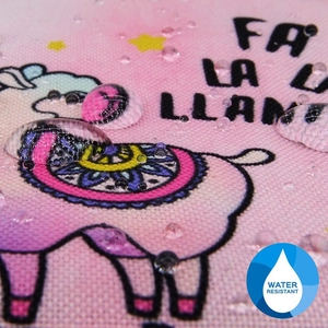 Macro shot showing the water resistant surface of the pink alpaca coin purse fabric