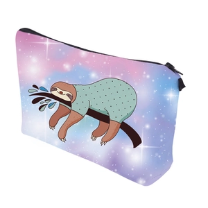 Close-up of waterproof travel pouch featuring cute sloth print and cosmic star pattern