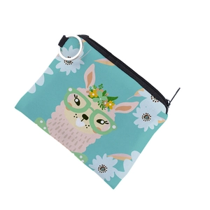 Detail of square alpaca coin purse with blue canvas floral print and metal keychain