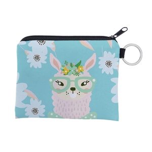 Close-up of canvas alpaca coin purse with floral wreath, glasses and silver keyring
