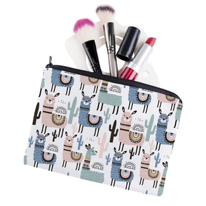 Rectangular cactus and alpaca print makeup bag with brushes and cosmetics